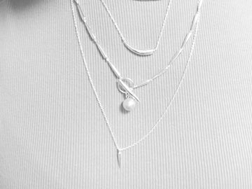 How to Layer Gold Necklaces Like a Pro